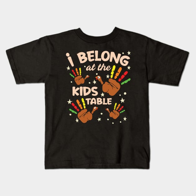 I Belong At The Kids Table Thanksgiving Fun Family Graphic Kids T-Shirt by Graphic Duster